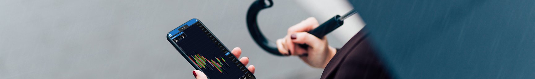 Woman with OANDA Mobile App on her phone