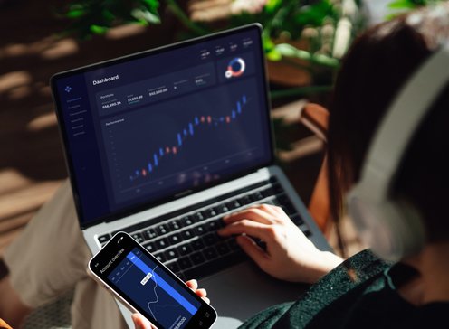 Stocks_Laptop_Phone_Woman